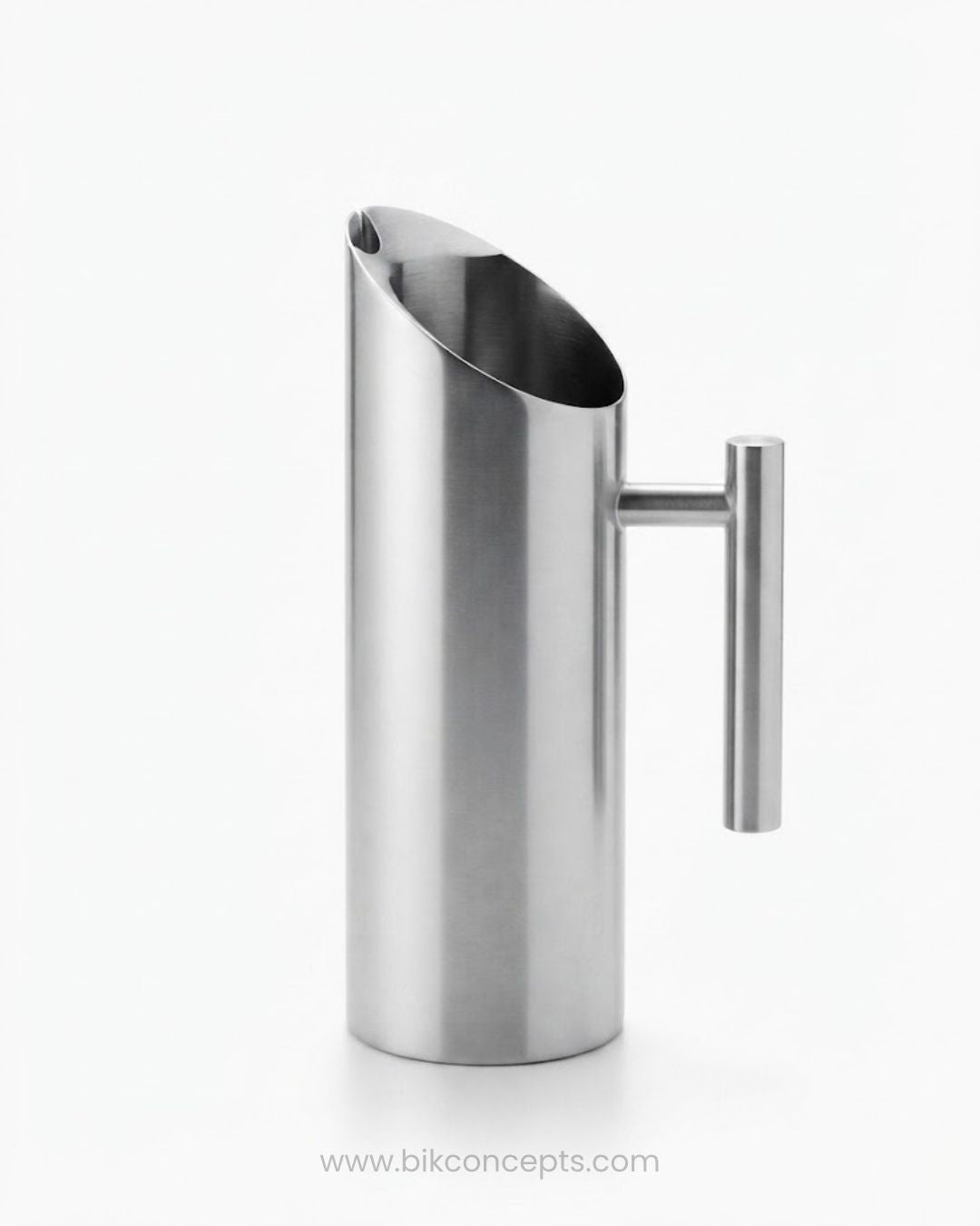 A modern stainless steel pitcher with a slanted pouring spout and a cylindrical side handle, Commercial Stainless Steel Water Pitcher, 1.5 Liter Stainless Beverage Jug, Hotel Room Service Water Jug, Catering Stainless Steel Carafe, Modern Cylinder Beverage Pitcher, Stainless Steel Pitcher with Ice Guard, Commercial Dining Room Water Pitcher, Silver Stainless Steel Serving Jug, Hotel Banquet Water Pitcher, Restaurant Metal Drink Pitcher