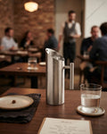 Commercial Stainless Steel Water Pitcher, 1.5 Liter Stainless Beverage Jug, Hotel Room Service Water Jug, Catering Stainless Steel Carafe, Modern Cylinder Beverage Pitcher, Stainless Steel Pitcher with Ice Guard, Commercial Dining Room Water Pitcher, Silver Stainless Steel Serving Jug, Hotel Banquet Water Pitcher, Restaurant Metal Drink Pitcher