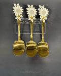 Three gold-colored spoons with white sunflower handles, Gold Stainless Steel Rice Serving Spoon, Sunflower Flat Rice Paddle, 11 Inch Flat Gold Serving Spoon, Set of 3 Gold Rice Spoons, Set of 5 Buffet Rice Paddles, Decorative Floral Handle Kitchen Utensils, Gold Biryani Serving Spoon Set, Luxury Tableware Rice Server, Decorative Flat Serving Utensils, High End Entertaining Rice Paddle