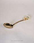 A gold-colored metal spoon with a decorative sunflower handle, Gold Stainless Steel Serving Spoon, Sunflower Decorative Serving Set, 11 Inch Round Gold Serving Spoons, Set of 3 Gold Buffet Spoons, Set of 5 Tableware Serving Spoons, Floral Enamel Handle Flatware, Luxury Gold Serving Utensils, Decorative Kitchen Serving Spoons, High End Entertaining Cutlery, Gold Rice and Curry Serving Spoon
