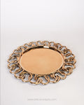 A round decorative tray with a smooth, reflective gold center and an ornate, interlocking ring border, Gold Charger Plates Set of 6, Interlocking Loop Plastic Charger Plates, 13 Inch Round Service Plates, Luxury Wedding Table Decor US, Catering Charger Plates Bulk, Openwork Chain Link Underplates, Gold Metallic Place Setting Base Plates, Modern Event Decor Charger Plates, Wholesale Catering Tableware, High End Dinnerware Chargers