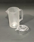 A translucent frosted plastic measuring pitcher with a handle and pouring spout, shown next to its clear plastic lid, Commercial Polypropylene Beverage Pitcher, 2.4 Liter Clear Plastic Water Jug, Shatterproof Catering Drink Pitcher, Hotel Buffet Beverage Service Pitcher, Measuring Plastic Pitcher with Lid, Restaurant Plastic Iced Tea Pitcher, Heavy Duty Commercial Plastic Jug, 2400ml Graduated Drink Pitcher, Outdoor Catering Plastic Pitcher, Clear Polypropylene Water Serving Jug