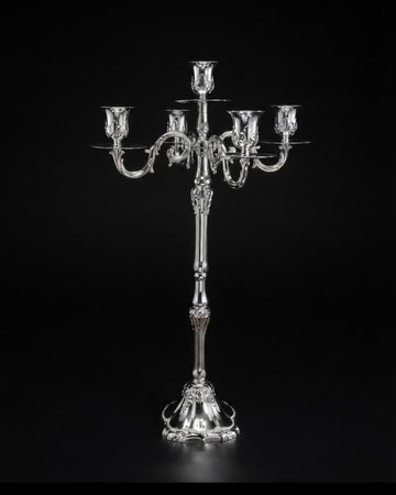A polished silver candelabra with five arms, featuring ornate sculpted details and a decorative pedestal base,26 Inch Silver Candelabra, 5 Light Metal Candle Stand, Tall Silver Candle Holder USA, Luxury Table Centerpiece Candelabra, Vintage Rococo Silver Candelabra, High End Wedding Centerpiece Stand, Polished Silver Taper Candle Holder, Designer Estate Mantel Decor, Classical European Metal Candle Stand, Elegant Dinner Party Table Accent