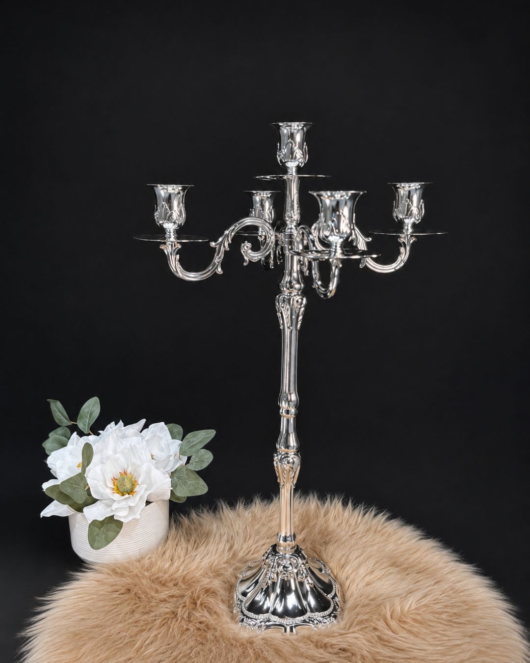 A polished silver candelabra with five arms stands26 Inch Silver Candelabra, 5 Light Metal Candle Stand, Tall Silver Candle Holder USA, Luxury Table Centerpiece Candelabra, Vintage Rococo Silver Candelabra, High End Wedding Centerpiece Stand, Polished Silver Taper Candle Holder, Designer Estate Mantel Decor, Classical European Metal Candle Stand, Elegant Dinner Party Table Accent