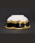 A decorative bowl with a glossy white upper half, a black lower half, and an ornate metallic gold wavy border separating the two sections, 28 Piece Porcelain Dinnerware Set, Luxury Gold Plated Dinner Set, Black and Gold Crockery Set for 6, High End Porcelain Dish Set USA, Designer Scalloped Edge Dinnerware, Regal Baroque Gold Dinner Plates, Elegant Estate Dining Table Set, Luxury Wedding Registry Crockery, Gold Rimmed Soup Bowl Set, Fine Porcelain Oval Serving Platter