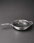A stainless steel sauté pan with a matching glass lid featuring a metal handle, Honeycomb Stainless Steel Wok, 5.7 Quart Karahi Pan with Lid, Luxury Stainless Steel Chef Pan, Designer 12.5 Inch Stir Fry Pan USA, Non Stick Stainless Steel Wok, High End Gourmet Serving Pan, Professional Grade Hybrid Cookware, Induction Compatible Karahi Wok, Estate Kitchenware Gourmet Pans, Large Capacity Stainless Steel Wok