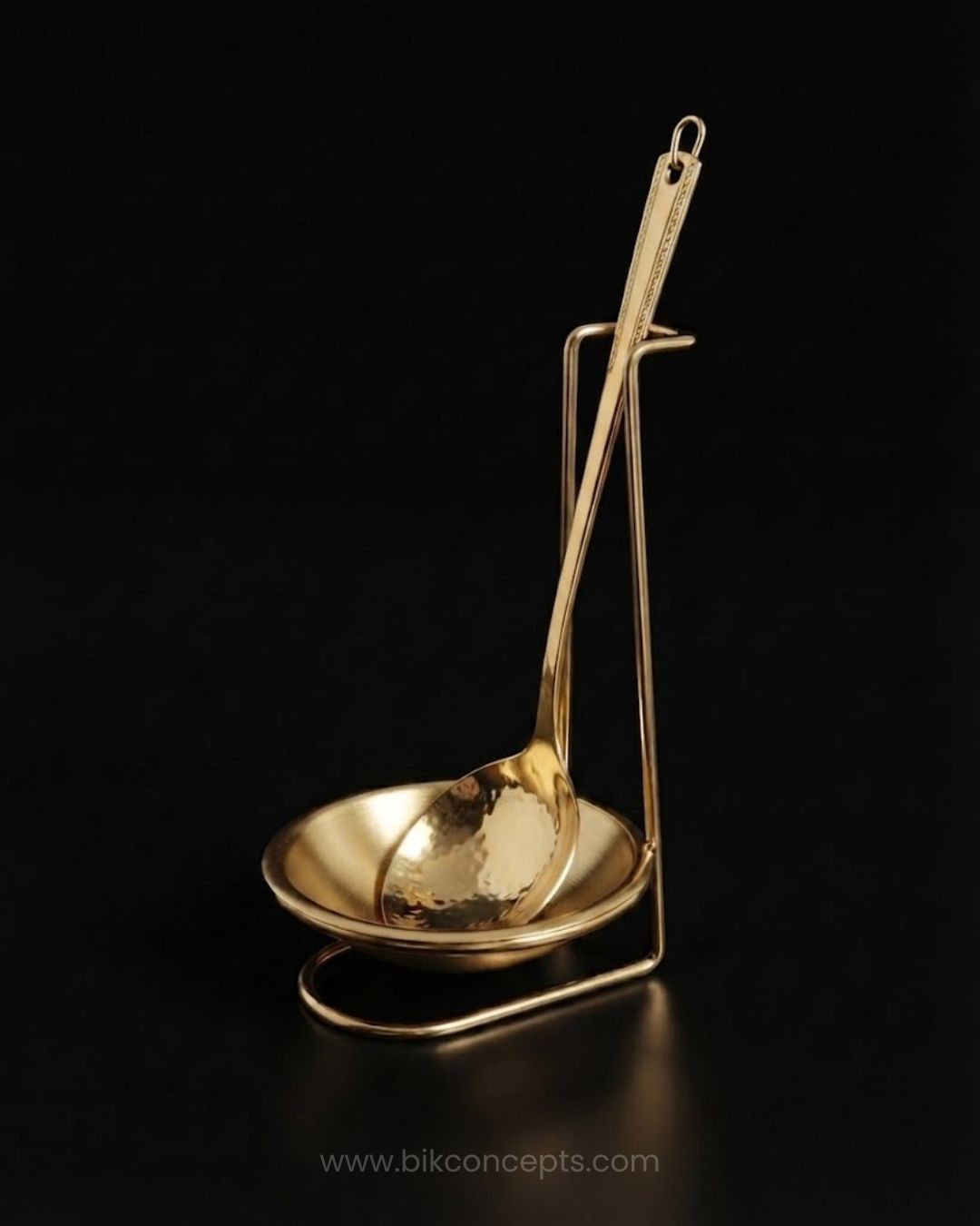 A polished gold-colored metal ladle with a matching shallow bowl and stand, Gold Stainless Steel Spoon Rest, Vertical Ladle Holder Stand, Gold Utensil Rest for Buffets, Luxury Catering Tableware Accessories, Standing Spoon Holder with Drip Bowl, Brushed Gold Soup Ladle Stand, Catering Buffet Drip Tray, High End Dining Table Spoon Rest, Stainless Steel Tabletop Utensil Stand, Gold Buffet Counter Organizer