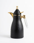 A black hammered metal coffee pot with gold-tone metal accents and a clear glass handle,
Black Hammered Steel Coffee Thermos, 1 Liter Thermal Coffee Carafe, Black and Gold Vacuum Flask, Luxury Catering Coffee Dispenser, Decorative Black Tea Carafe, Dallah Style Coffee Server, Insulated Beverage Carafe for Weddings, Thermal Flask for Catering Events, High End Hot Water Thermos USA, Matte Black Vacuum Insulated Pitcher