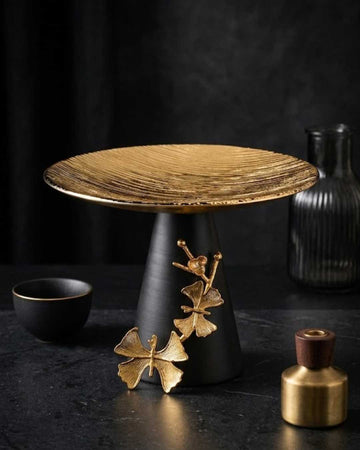 Gold Cake Stand, Matte Black Pedestal, Luxury Dessert Platter, Elegant Serving Stand, Ginkgo Leaf Decor, Round Pastry Display, Modern Table Centerpiece, High-End Cupcake Tower, Gourmet Food Presentation, Wedding Dessert Pedestal, Decorative Appetizer Tray, Sophisticated Tableware, Chic Pastry Holder, Hostess Gift Idea, Luxury Buffet Server, Black and Gold Servingware, Elegant Party Platters, Decorative Cake Pedestal, Artisan Food Display, Fine Dining Accessories