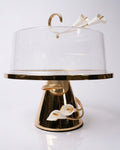 Gold Lily Cake Stand, Luxury Dessert Display Stand, Cake Stand with Acrylic Dome, High End Catering Cake Platter, Floral Gold Cake Pedestal, Wedding Dessert Table Display, Decorative Cake Dome Cover, Elegant Gold Dessert Server, Luxury Event Buffet Accessories