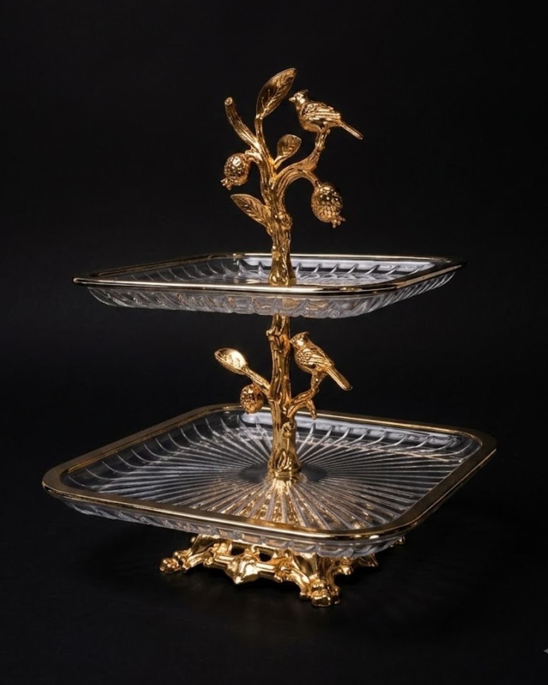 A two-tiered serving stand with clear cut-glass trays and ornate gold-tone metal branches, leaves, and birds, photographed against a black background.
Gold 2 Tier Glass Serving Stand, Square Tiered Dessert Stand, Luxury Home Party Serving Tray, Botanical Bird Food Stand, Cut Glass Square Appetizer Tray, Gold Metal and Glass Pastry Tower, Afternoon Tea Dessert Display, Decorative Square Fruit and Dessert Stand, Gold Pedestal Glass Serving Platter, Elegant Square Tiered Buffet Stand
