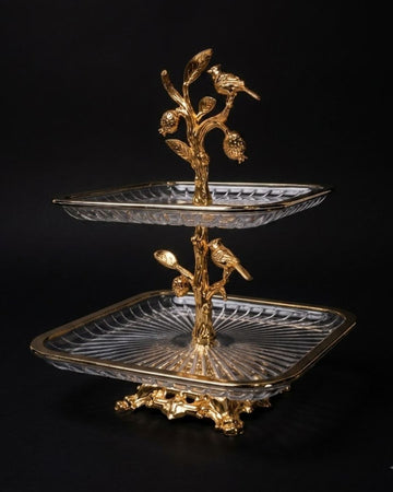 A two-tiered serving stand with clear cut-glass trays and ornate gold-tone metal branches, leaves, and birds, photographed against a black background.
Gold 2 Tier Glass Serving Stand, Square Tiered Dessert Stand, Luxury Home Party Serving Tray, Botanical Bird Food Stand, Cut Glass Square Appetizer Tray, Gold Metal and Glass Pastry Tower, Afternoon Tea Dessert Display, Decorative Square Fruit and Dessert Stand, Gold Pedestal Glass Serving Platter, Elegant Square Tiered Buffet Stand