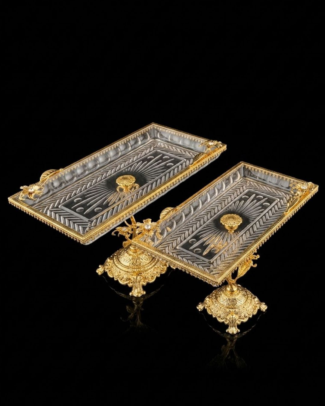 Two ornate rectangular silver trays with engraved geometric patterns and gold-tone decorative borders, stands, and handles, displayed on a reflective black background.

Gold Pedestal Glass Serving Tray, Rectangular Glass Centerpiece Bowl, Vintage Gold Raised Dessert Platter, Floral Stem Footed Glass Tray, Luxury Table Centerpiece Dish, Gold Metal and Cut Glass Serving Tray, Decorative Coffee Table Platter, Crystal Gem Floral Serving Dish, High-End Appetizer Display Platter, Antique Style Gold Pedestal Tray