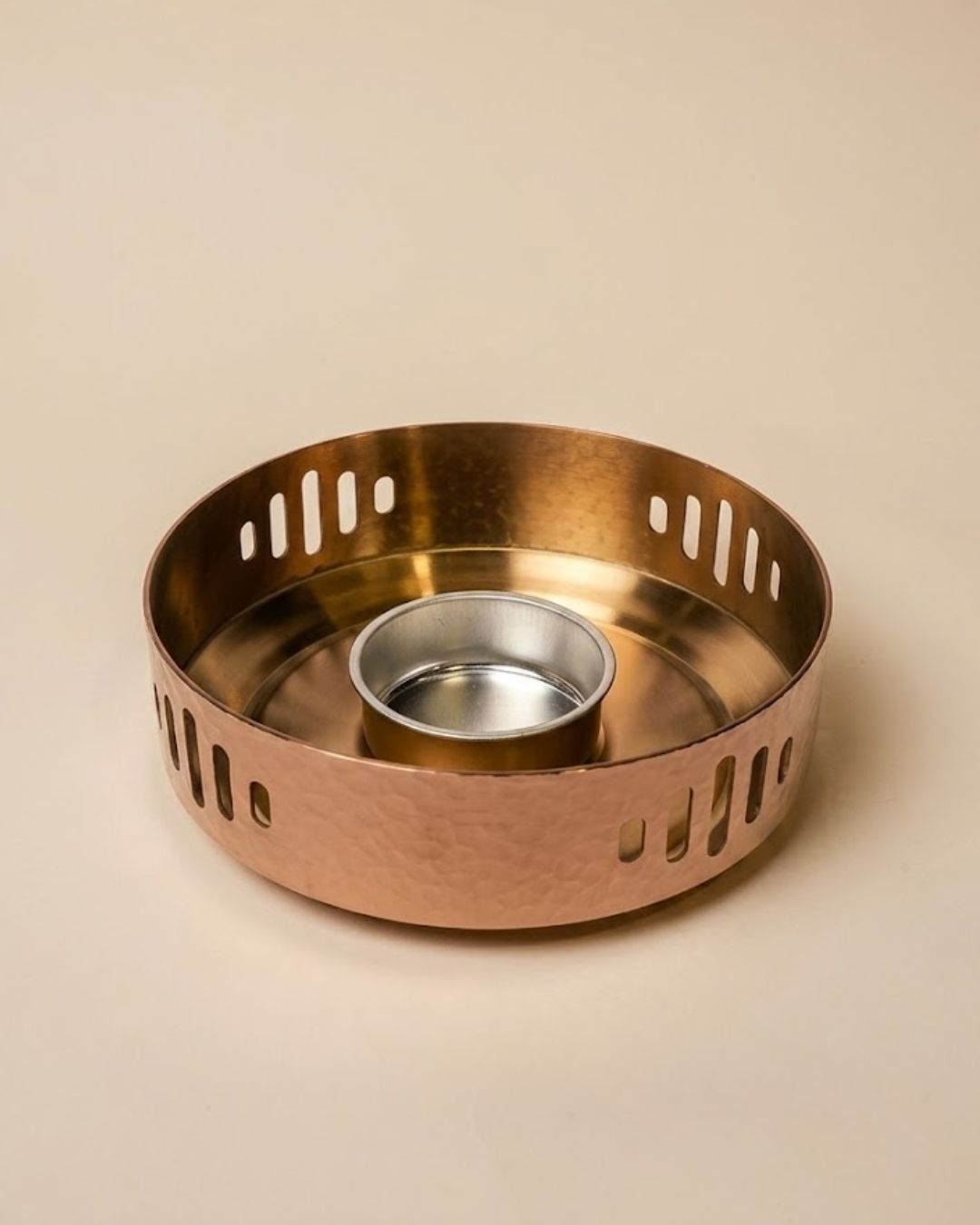 A hammered copper candle holder with a slotted outer rim and a small central silver cup, photographed on a plain beige background.

Rose Gold Buffet Server with Burner, Triply Stainless Steel Chafing Dish, Hammered Copper Food Warmer Dish, Round Buffet Chafing Server, Luxury Food Warmer for Parties, Stainless Steel Hot Pot Server, Decorative Rose Gold Serving Dish with Lid, Main Course Food Warmer with Fuel Holder, High End Buffet Server USA, Premium Triply Party Chafing Dish