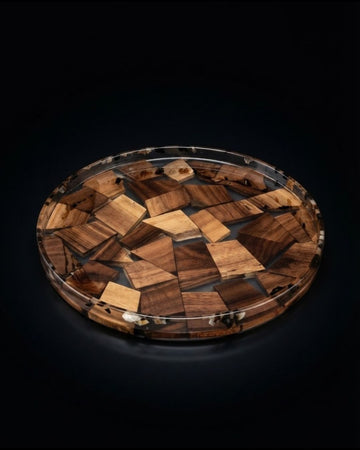 A round clear resin tray filled with inlaid irregular wooden pieces in varying shades of brown,Wood and Epoxy Resin Serving Tray, Handcrafted Round Wood Tray, Mosaic Timber Resin Platter, Nature Enthusiast Home Decor, Clear Resin Charcuterie Board, Organic Wood Coffee Table Tray, Artisan Resin Serving Platter, Rustic Modern Wood Accent Tray, Clear Resin Drink Tray, Eco Friendly Natural Wood Serving Board