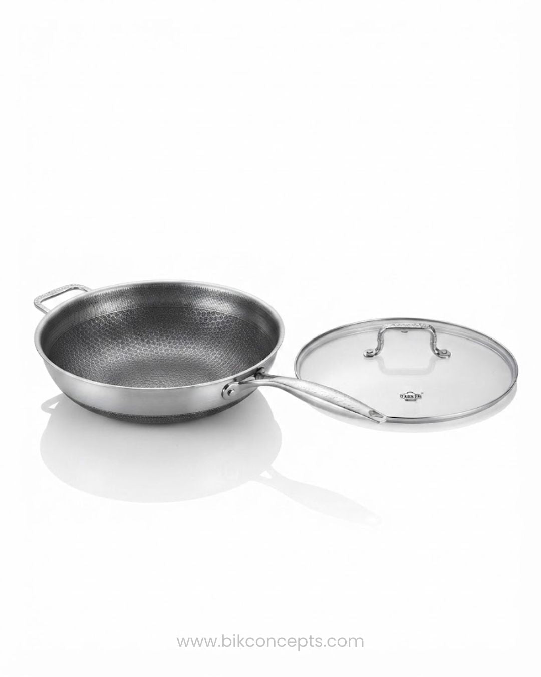A stainless steel sauté pan with a matching glass lid featuring a metal handle, Honeycomb Stainless Steel Wok, 5.7 Quart Karahi Pan with Lid, Luxury Stainless Steel Chef Pan, Designer 12.5 Inch Stir Fry Pan USA, Non Stick Stainless Steel Wok, High End Gourmet Serving Pan, Professional Grade Hybrid Cookware, Induction Compatible Karahi Wok, Estate Kitchenware Gourmet Pans, Large Capacity Stainless Steel Wok