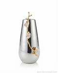 A modern teardrop-shaped metallic silver vase with a gold branch and white flower accent, 12 Inch Stainless Steel Vase, Luxury Jasmine Flower Vase, High End Metallic Centerpiece Vase, Botanical Floral Decor Vase for Catering, Modern Silver Tabletop Vase, Premium Event Floral Presentation USA, Designer Metal Console Vessel, Gold and Silver White Flower Vase, Luxury Wedding Centerpiece Vase, Tarnish Resistant Stainless Steel Decor