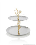 A two-tiered serving stand with scalloped white plates and a gold branch-and-flower central structure, 2 Tier Stainless Steel Platter, Luxury Tiered Dessert Stand, Jasmine Collection Serving Tray, High End Catering Platter USA, Silver Tiered Pastry Stand, Botanical Metal Buffet Display, Gold and Silver Tiered Tray, Designer Afternoon Tea Stand, Luxury Wedding Food Display, Decorative 2 Tier Metal Server