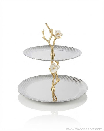 A two-tiered serving stand with scalloped white plates and a gold branch-and-flower central structure, 2 Tier Stainless Steel Platter, Luxury Tiered Dessert Stand, Jasmine Collection Serving Tray, High End Catering Platter USA, Silver Tiered Pastry Stand, Botanical Metal Buffet Display, Gold and Silver Tiered Tray, Designer Afternoon Tea Stand, Luxury Wedding Food Display, Decorative 2 Tier Metal Server