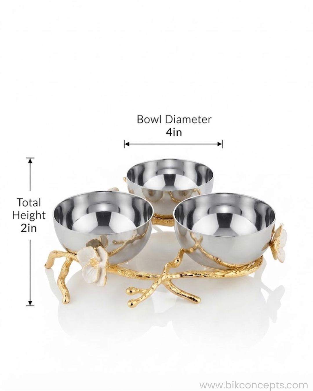 Three small metallic bowls arranged on a decorative gold branch-style base with white flower accents, shown on a white background with overlaid dimension labels reading bowl diameter 4in and total height 2in.