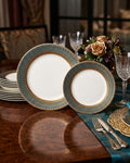 A set of elegant dinner plates with a white center and a blue-green border patterned with gold, styled on a dark wooden dining table with cutlery, glasses, and a floral centerpiece, Luxury Porcelain Dinner Plate Set of 6, Hotel Commercial Porcelain Tableware Bulk, Gold Rimmed Dessert Plate 8 Inch Set, Green and Gold Catering Plates Pack, Fine Dining Porcelain Dinnerware Set, 10.5 Inch Commercial Dinner Plate 6 Pack, Special Event Catering Plates Set, Luxury Wedding Banquet Dinnerware Bulk,