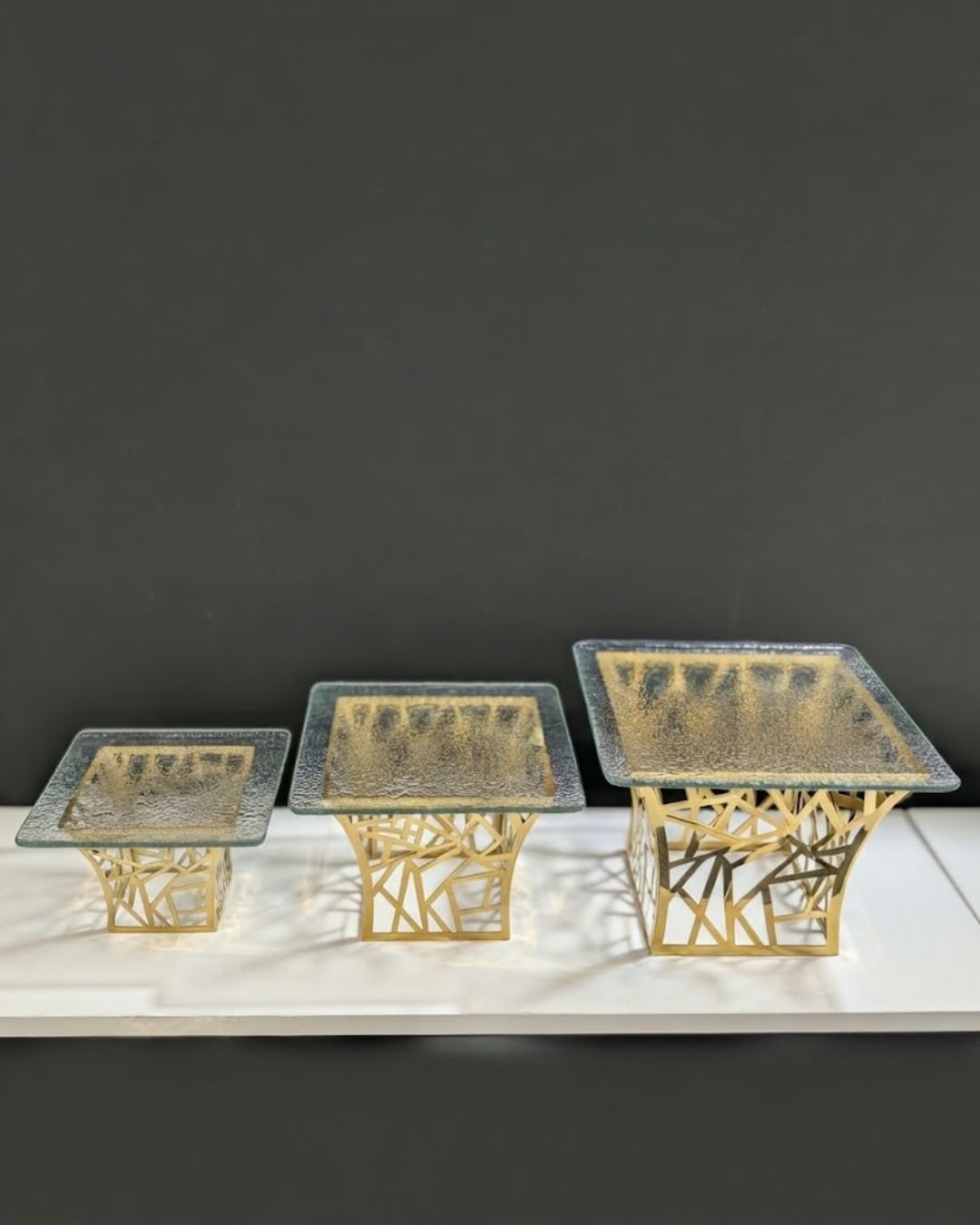 Gold Geometric Flared Buffet Riser, Metal Abstract Food Display Stand with Glass Top, Luxury Pyramid Buffet Riser for Hotel Catering, Gold Web Cutout Display Pedestal, High End Event Dessert Stand, Decorative Flared Food Riser, Abstract Gold Buffet Stand Small Medium Large, Modern Wedding Catering Elevation Stand, Gold Metal Geometric Display Riser, Luxury Tabletop Buffet Risers