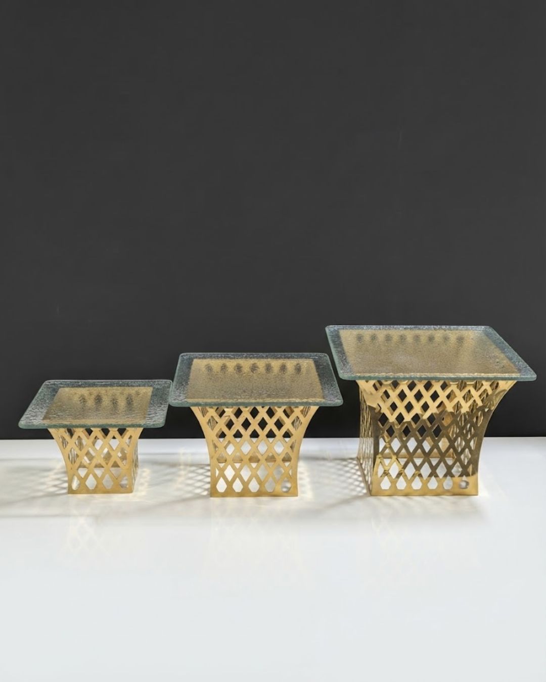 Gold Tapered Lattice Buffet Riser, Metal Food Display Stand with Glass Top, Luxury Flared Buffet Riser for Hotel Catering, Gold Diamond Cutout Display Pedestal, High End Event Dessert Stand, Decorative Tapered Food Riser, Flared Gold Buffet Stand Small Medium Large, Modern Wedding Catering Elevation Stand, Gold Metal Hourglass Display Riser, Luxury Tabletop Buffet Risers