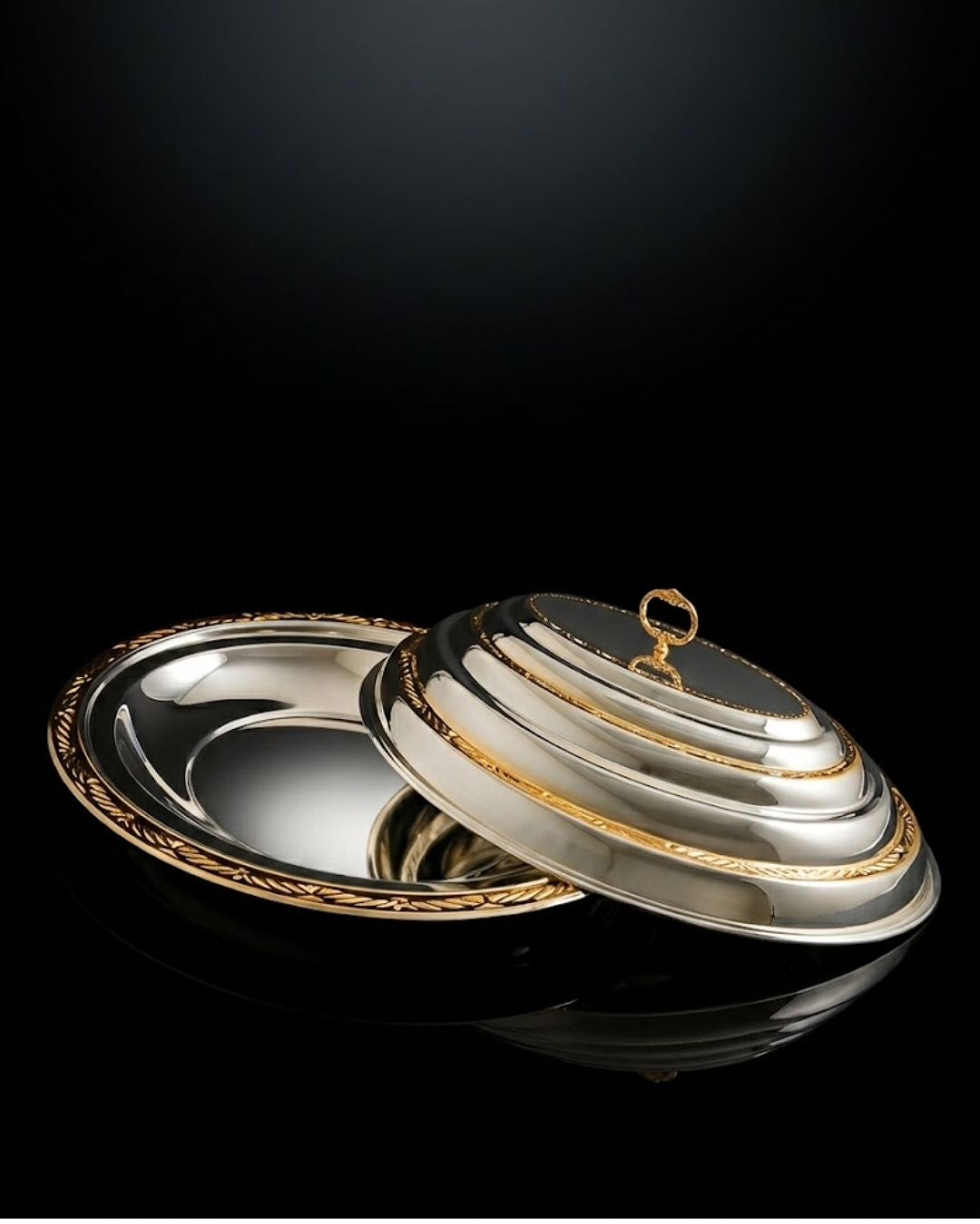 oval serving dish, oval covered serving dish, silver and gold serving dish, two tone serving platter, luxury serving platter, covered serving platter, serving dish with dome lid, oval serving platter with lid, silver gold serving platter, luxury covered platter, decorative serving dish, elegant serving platter, premium serving dish, large oval serving dish, formal dining serving dish, luxury tableware, elegant tableware, statement serving dish, covered food serving dish, dome lid serving platter