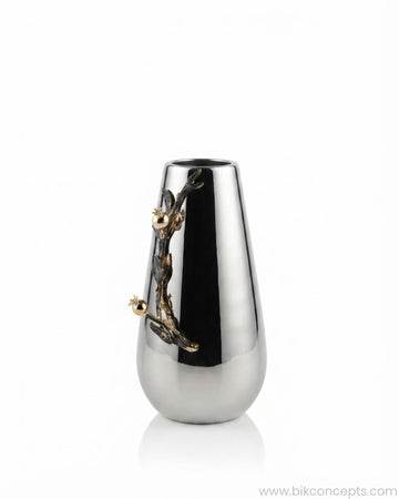 A modern teardrop-shaped metallic vase with a polished silver body and a sculptural gold branch and flower accent on the side, 12 Inch Stainless Steel Vase, Luxury Pomegranate Flower Vase, High End Metallic Centerpiece Vase, Botanical Silver Decor Vase for Catering, Modern Silver Tabletop Vase, Premium Event Floral Presentation USA, Designer Metal Console Vase, Antique Gold and Silver Decorative Vessel, Luxury Wedding Centerpiece Vase, Tarnish Resistant Stainless Steel Decor