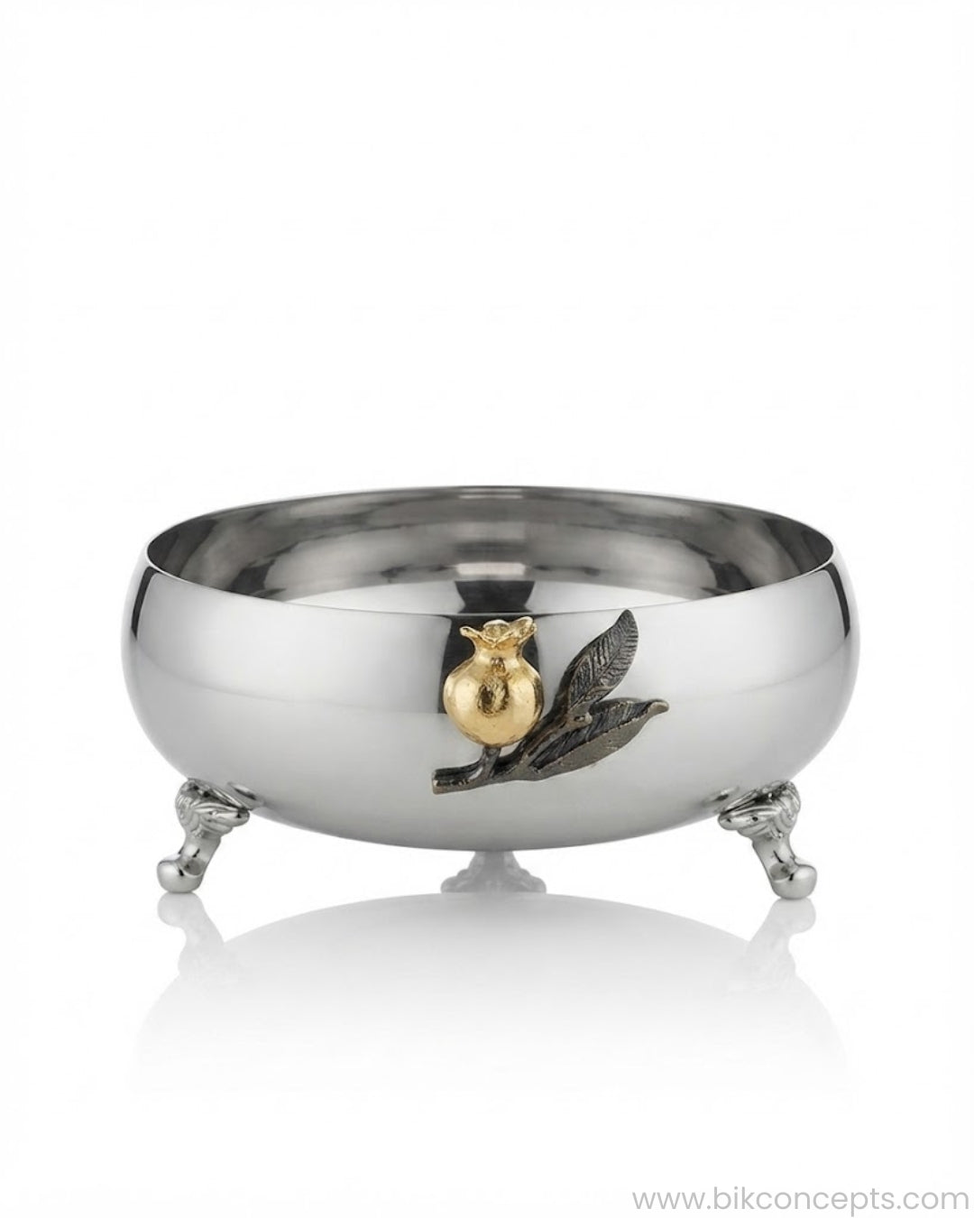 A polished silver footed bowl with a gold and silver pomegranate and leaf motif on the front, 9 Inch Stainless Steel Footed Bowl, Luxury Pomegranate Centerpiece Bowl, High End Decor Bowl for Home, Botanical Metal Server for Catering, Silver Footed Serving Basin, Premium Catering Food Presentation USA, Designer Tabletop Centerpiece Vessel, Antique Gold and Silver Fruit Bowl, Luxury Wedding Tableware, Decorative Metal Bowl for Console
