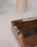 A close-up of a rectangular wooden tray with a dark brown wood grain finish and a tortoiseshell-patterned resin inlay along the rim, Wood and Epoxy Resin Serving Tray, Rectangular Solid Wood Serving Tray, Natural Timber Catchall Tray, Nature Enthusiast Home Accessories, Shell Inlaid Resin Platter, Handcrafted Wooden Coffee Tray, Coastal Organic Decor Tray, Slim Rectangular Serving Board, Wooden Vanity Catchall 12x6, Biophilic Home Hosting Decor