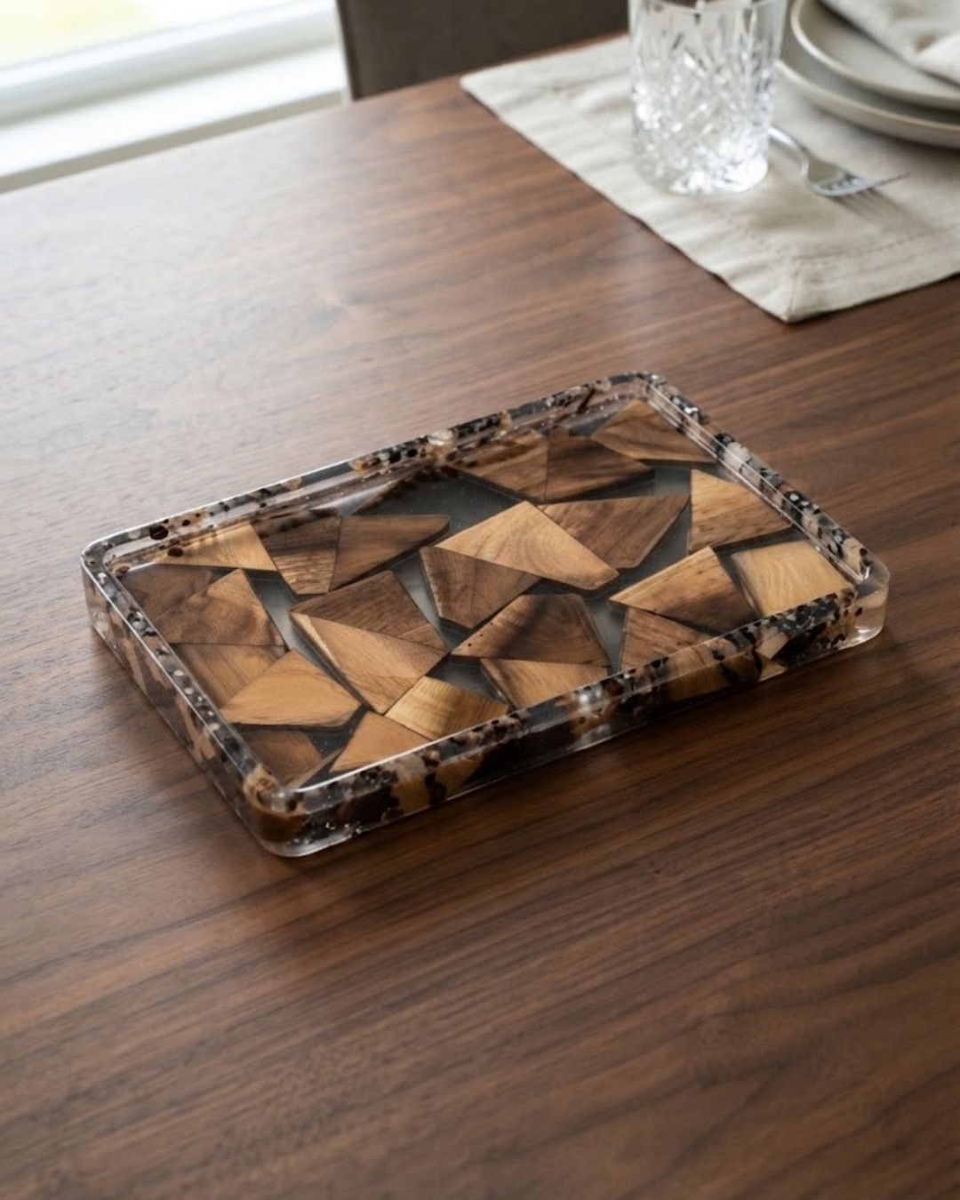 A rectangular resin tray with a geometric wood-patterned design, Wood and Epoxy Resin Serving Tray, Rectangular Resin Serving Platter, Geometric Wood Mosaic Tray, Nature Enthusiast Home Decor, Clear Epoxy Charcuterie Board, Natural Timber Accent Tray, Organic Wood Coffee Table Tray, Artisan Resin Drink Tray, Rectangular Wood Serving Board, Biophilic Home Accessories