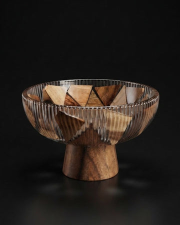 A wooden pedestal bowl with a ribbed exterior and triangular wood inlay pattern inside, Wood and Epoxy Resin Serving Bowl, Elevated Wooden Fruit Bowl, Fluted Resin Centerpiece Pedestal, Nature Enthusiast Home Accessories, Footed Wooden Snack Bowl, Resin Mosaic Decorative Bowl, Raised Timber Salad Bowl, Organic Modern Kitchen Pedestal Bowl, Artisanal Fluted Glass-Look Wood Bowl, Biophilic Home Decor Bowl