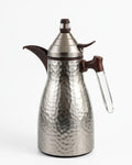 A stainless steel coffee pot with a hammered texture, dark brown wooden accents on the spout and handle, and a clear glass loop on the handle, shown on a white background.
Silver Hammered Steel Coffee Thermos, 1 Liter Thermal Coffee Carafe, Silver and Wood Vacuum Flask, Luxury Catering Coffee Dispenser, Decorative Silver Tea Carafe, Dallah Style Coffee Server, Insulated Beverage Carafe for Weddings, Thermal Flask for Catering Events, High End Hot Water Thermos USA, Brushed Stainless Vacuum Insulated Pitcher