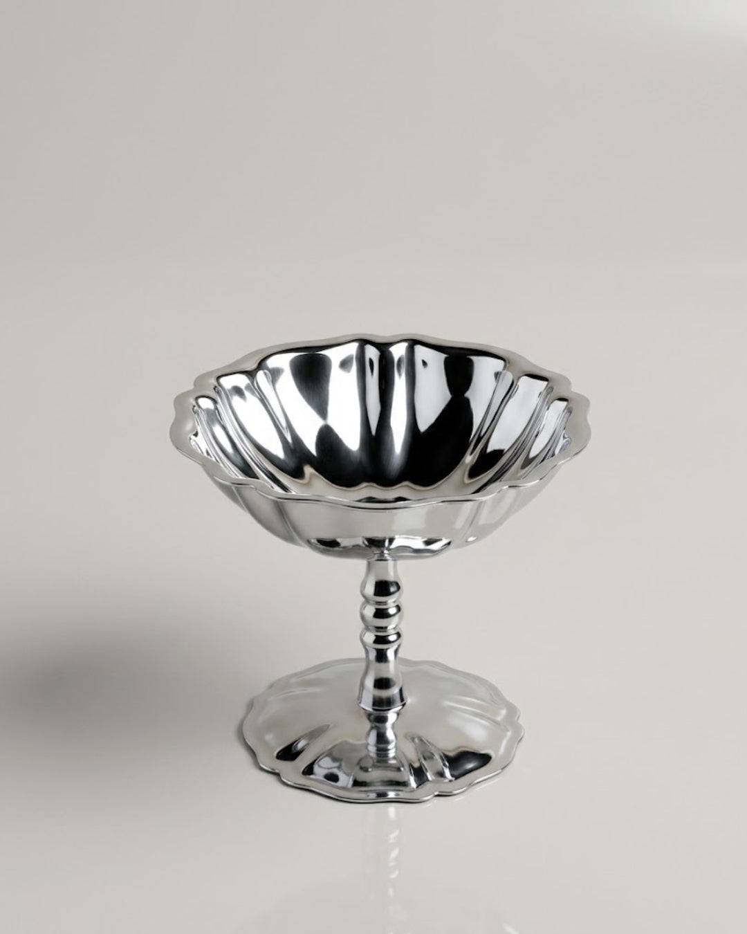 A polished silver pedestal bowl with a fluted rim and a flared base, photographed on a clean light gray studio background.

Silver Stainless Steel Dessert Bowl, Pedestal Ice Cream Cup, Silver Sundae Dish, Metal Sorbet Goblet, Individual Catering Dessert Cup, Fluted Silver Fruit Bowl, Vintage Style Stainless Steel Dessert Cup, Shatterproof Catering Dessert Ware USA, Commercial Ice Cream Pedestal Dish, Polished Silver Mousse Bowl