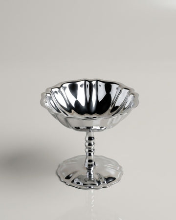 A polished silver pedestal bowl with a fluted rim and a flared base, photographed on a clean light gray studio background.

Silver Stainless Steel Dessert Bowl, Pedestal Ice Cream Cup, Silver Sundae Dish, Metal Sorbet Goblet, Individual Catering Dessert Cup, Fluted Silver Fruit Bowl, Vintage Style Stainless Steel Dessert Cup, Shatterproof Catering Dessert Ware USA, Commercial Ice Cream Pedestal Dish, Polished Silver Mousse Bowl