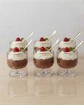 Six dessert cups filled with chocolate pudding or mousse, topped with whipped cream, a raspberry, mint, and a gold spoon, arranged on a light wooden surface against a neutral background.
Textured Glass Dessert Bowls, 5.5 oz Ice Cream Cups Set of 6, Footed Sundae Dishes, Gold Rim Parfait Glasses, Hammered Glass Dessert Cups, Mini Trifle Dishes for Catering, Commercial Catering Glassware USA, Clear Footed Sorbet Cups, Vintage Style Ripple Sundae Glass, Heavy Duty Mini Dessert Glasses